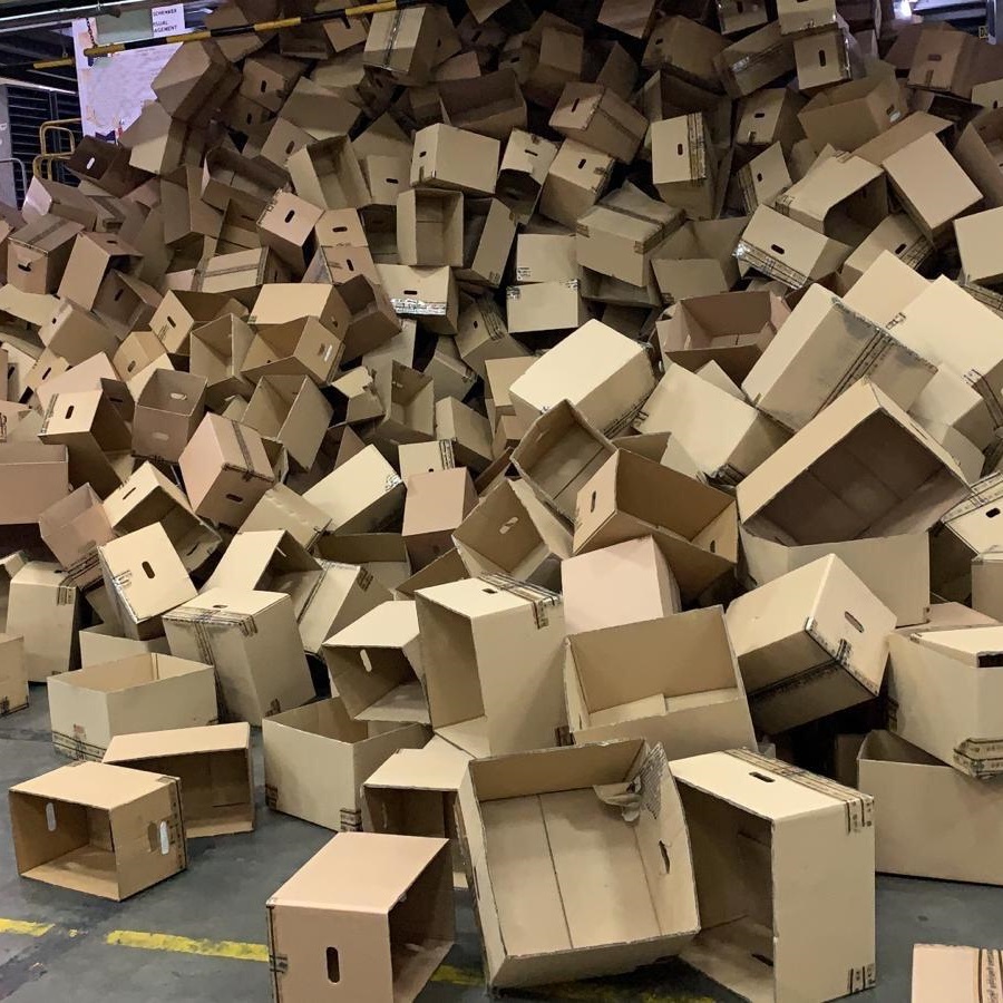 Unflattened cardboard boxes collected for recycling at a warehouse in Singapore.
